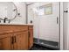 Modern bathroom with walk-in shower featuring white subway tile and sleek black hardware at 1336 Mcclelland Ave, Atlanta, GA 30344