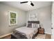 Bright bedroom with ceiling fan, stylish décor, and comfortable bedding at 1336 Mcclelland Ave, Atlanta, GA 30344