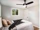 Well-lit bedroom featuring a ceiling fan, comfortable bed, and a bright window at 1336 Mcclelland Ave, Atlanta, GA 30344
