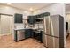 Modern kitchen with stainless steel appliances, white countertops, and blue cabinets at 1336 Mcclelland Ave, Atlanta, GA 30344