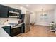 Well-lit kitchen with stainless steel appliances, white countertops, and stylish cabinets at 1336 Mcclelland Ave, Atlanta, GA 30344