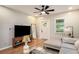 Bright living room with hardwood floors, modern furnishings, and a ceiling fan at 1336 Mcclelland Ave, Atlanta, GA 30344