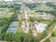Community aerial view showcasing the pool, clubhouse, playground, and tennis courts nestled among the homes at 1405 Rainey Way, Hampton, GA 30228