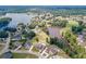 Expansive aerial view showcasing the homes and scenic lake of this community with lush greenery surrounding the area at 1405 Rainey Way, Hampton, GA 30228