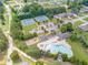 Aerial view highlighting community amenities, including a playground, pool, clubhouse and tennis courts at 1405 Rainey Way, Hampton, GA 30228