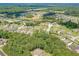 Overhead view showcases this community with lush trees and well-spaced single-Gathering homes at 1405 Rainey Way, Hampton, GA 30228
