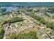 Aerial view highlighting a neighborhood with mature trees, well-maintained lawns, and various home styles at 1405 Rainey Way, Hampton, GA 30228