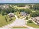 Aerial view of a beautiful, landscaped neighborhood with large, luxurious homes at 1405 Rainey Way, Hampton, GA 30228