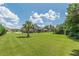 Expansive backyard with mature trees, providing ample space and privacy for outdoor activities and relaxation at 1405 Rainey Way, Hampton, GA 30228