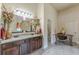 Large bathroom includes granite countertops, double vanity, and decorative vases at 1405 Rainey Way, Hampton, GA 30228