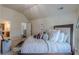 Bright bedroom boasts a well-made bed and an ensuite bathroom, creating a convenient and peaceful retreat at 1405 Rainey Way, Hampton, GA 30228