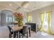 Open dining area boasts natural light and a decorative floral arrangement at 1405 Rainey Way, Hampton, GA 30228