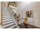 Elegant foyer with a staircase and decorative accents, creating a warm and inviting entrance to the home at 1405 Rainey Way, Hampton, GA 30228