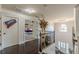 Upstairs hallway with hardwood floors and staircase leading to lower level at 1405 Rainey Way, Hampton, GA 30228