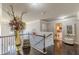 Hallway with hardwood floors, decor, and view of bathroom and bedroom at 1405 Rainey Way, Hampton, GA 30228