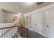Hallway with hardwood floors, decor, and multiple closets and access to rooms at 1405 Rainey Way, Hampton, GA 30228