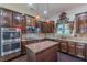 Spacious kitchen showcases granite counters, a stylish backsplash, and stainless steel appliances at 1405 Rainey Way, Hampton, GA 30228