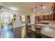 Spacious kitchen features hardwood floors, granite countertops, and modern stainless steel appliances at 1405 Rainey Way, Hampton, GA 30228