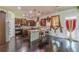 Gourmet kitchen with stainless steel appliances, granite countertops, and hardwood floors at 1405 Rainey Way, Hampton, GA 30228