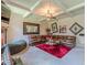 Spacious living room with plush seating, stylish decor, and unique ceiling design at 1405 Rainey Way, Hampton, GA 30228