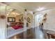 Open-concept living room featuring hardwood floors and beautiful decorative elements at 1405 Rainey Way, Hampton, GA 30228