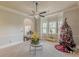 Spacious living room with a bay window, neutral carpet, and decorative accents creating a bright and airy atmosphere at 1405 Rainey Way, Hampton, GA 30228