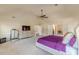 Large primary bedroom includes an entertainment area and ensuite bathroom at 1405 Rainey Way, Hampton, GA 30228