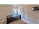 The home office features plush carpet and a large desk, creating a comfortable and productive workspace at 1405 Rainey Way, Hampton, GA 30228