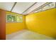 A bedroom painted yellow with a unique window setup at 4235 Apache Se Dr, Acworth, GA 30102