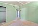 Bedroom with light green walls, closet, and view into another room at 4235 Apache Se Dr, Acworth, GA 30102