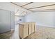 Kitchen view featuring an island, wood beam ceiling and wood look flooring at 4235 Apache Se Dr, Acworth, GA 30102
