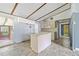Kitchen with new flooring, island and view to the outdoor screened space at 4235 Apache Se Dr, Acworth, GA 30102