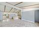Living room with open plan view to the kitchen and outdoor screened space at 4235 Apache Se Dr, Acworth, GA 30102