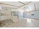 Open plan living room and kitchen with new flooring and ceiling fan at 4235 Apache Se Dr, Acworth, GA 30102