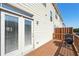 View of a private back deck with a grill and white siding at 5534 Radford Loop, Fairburn, GA 30213