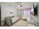 Charming bedroom featuring modern ceiling fan, daybed, and custom decor at 5534 Radford Loop, Fairburn, GA 30213