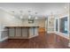 Spacious bar area featuring hardwood floors, wooden bar and neutral walls offers a relaxed entertainment space at 6685 Driskell Rd, Cumming, GA 30041