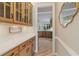 Hallway with built in cabinets and granite counter, showcasing the home's custom details at 6685 Driskell Rd, Cumming, GA 30041