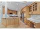 Open kitchen area with large center island, custom cabinets, and stainless steel appliances at 6685 Driskell Rd, Cumming, GA 30041