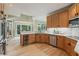 Spacious kitchen featuring stainless steel appliances, granite countertops, and ample cabinet space at 6685 Driskell Rd, Cumming, GA 30041