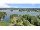 A scenic lake view with lush green trees, a parking lot, and mountains in the background at 6685 Driskell Rd, Cumming, GA 30041