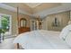 Cozy main bedroom features hardwood floors, a dresser, and a door to an outside deck at 6685 Driskell Rd, Cumming, GA 30041