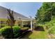 Lush backyard with a patio and beautiful landscaping offers great outdoor living space at 964 Natural Brook Trl, Lawrenceville, GA 30045