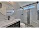Modern bathroom featuring marble tiles, sleek fixtures, and a glass-enclosed shower at 964 Natural Brook Trl, Lawrenceville, GA 30045