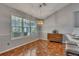 Bright breakfast nook with large windows, a stylish chandelier, and a wood dresser at 964 Natural Brook Trl, Lawrenceville, GA 30045