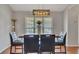 Chic dining area with a modern table setting, designer lighting, and natural light, ideal for gatherings at 964 Natural Brook Trl, Lawrenceville, GA 30045