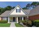 Charming front exterior showcasing a lovely porch, manicured landscaping, and classic architectural elements at 964 Natural Brook Trl, Lawrenceville, GA 30045