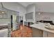 Modern kitchen with stainless steel appliances, gray cabinets, and a stylish breakfast bar at 964 Natural Brook Trl, Lawrenceville, GA 30045