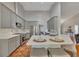 Contemporary kitchen features a breakfast bar, stainless appliances, and ample counter space at 964 Natural Brook Trl, Lawrenceville, GA 30045