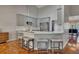 Modern kitchen with stainless steel appliances, gray cabinetry, and a breakfast bar with seating at 964 Natural Brook Trl, Lawrenceville, GA 30045